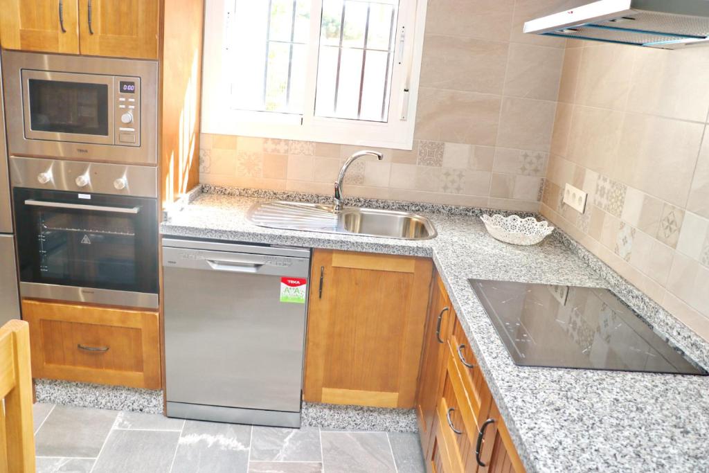 Kuchyň nebo kuchyňský kout v ubytování Chalet Brenes Sol