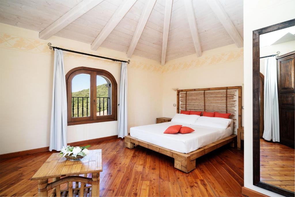 Postel nebo postele na pokoji v ubytování LH Hotel Pozzo Sacro