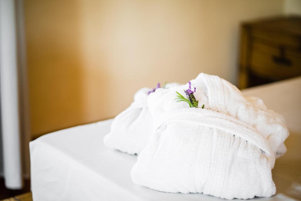 Postel nebo postele na pokoji v ubytování LH Hotel Pozzo Sacro