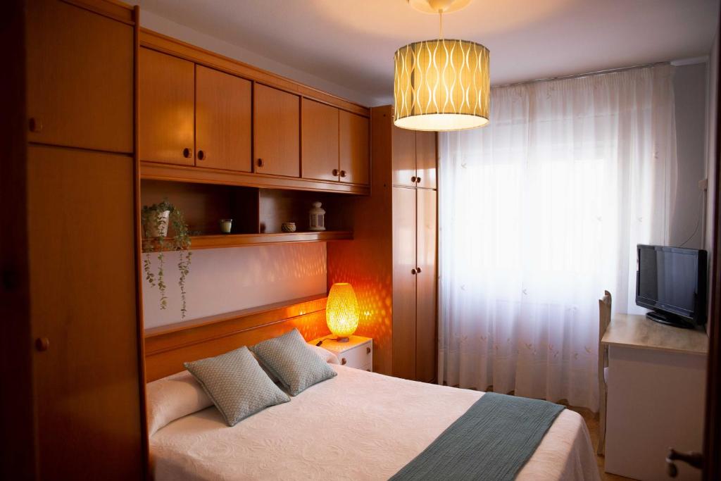 Postel nebo postele na pokoji v ubytování Les Fuentines
