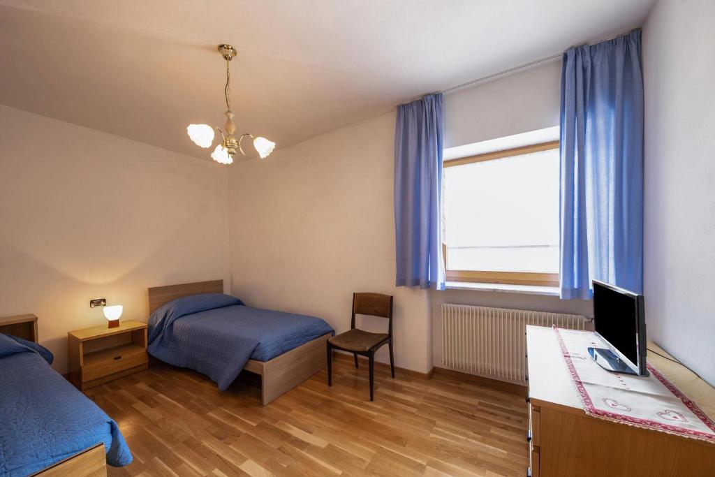 A bed or beds in a room at Appartamento Viola