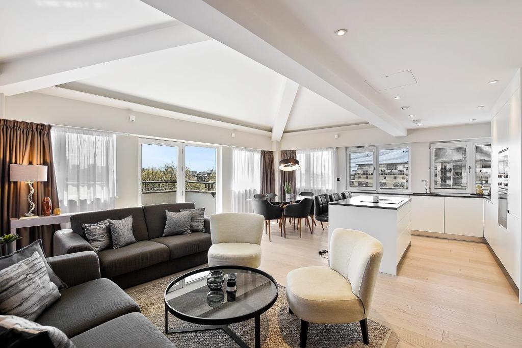 a living room with a couch and a table at VAUXHALL BRIDGE ROAD by Q Apartments in London