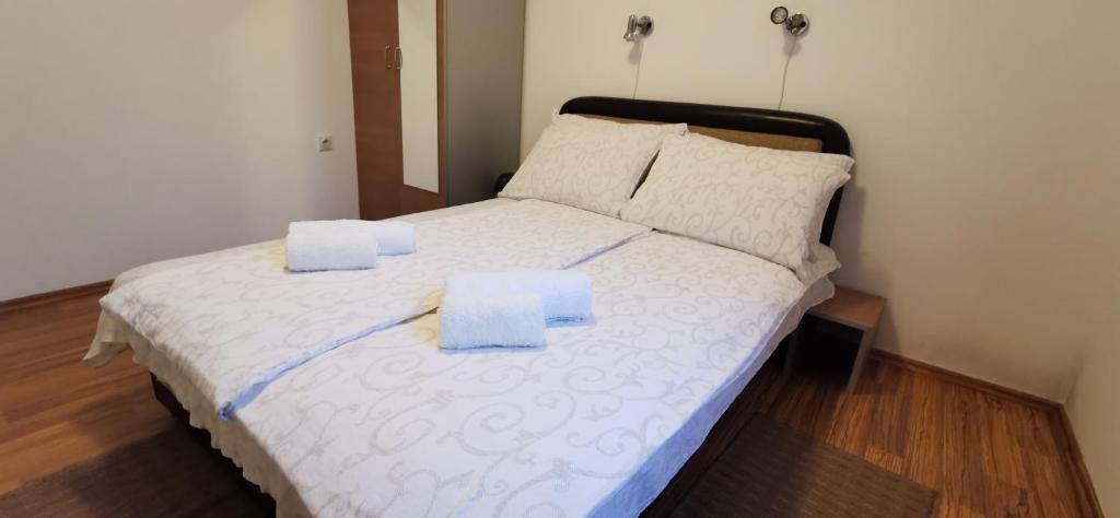 Postel nebo postele na pokoji v ubytování Apartments Banjica