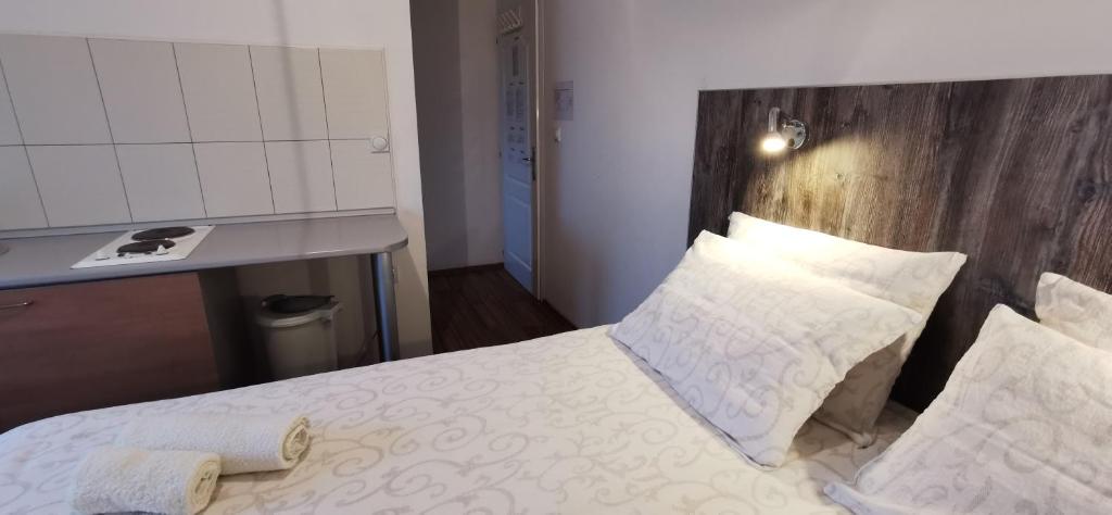 Postel nebo postele na pokoji v ubytování Apartments Banjica