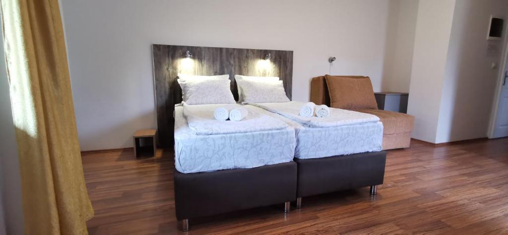 Postel nebo postele na pokoji v ubytování Apartments Banjica