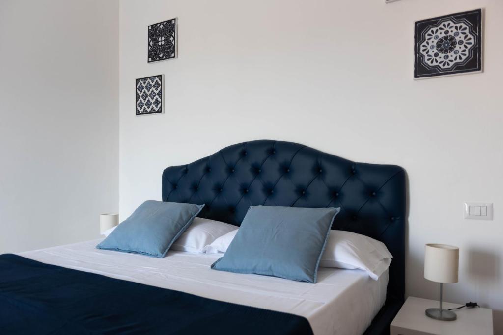 Postel nebo postele na pokoji v ubytování Sirentum Rooms