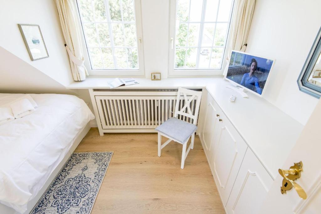 Postel nebo postele na pokoji v ubytování Soenshoern Whg 6