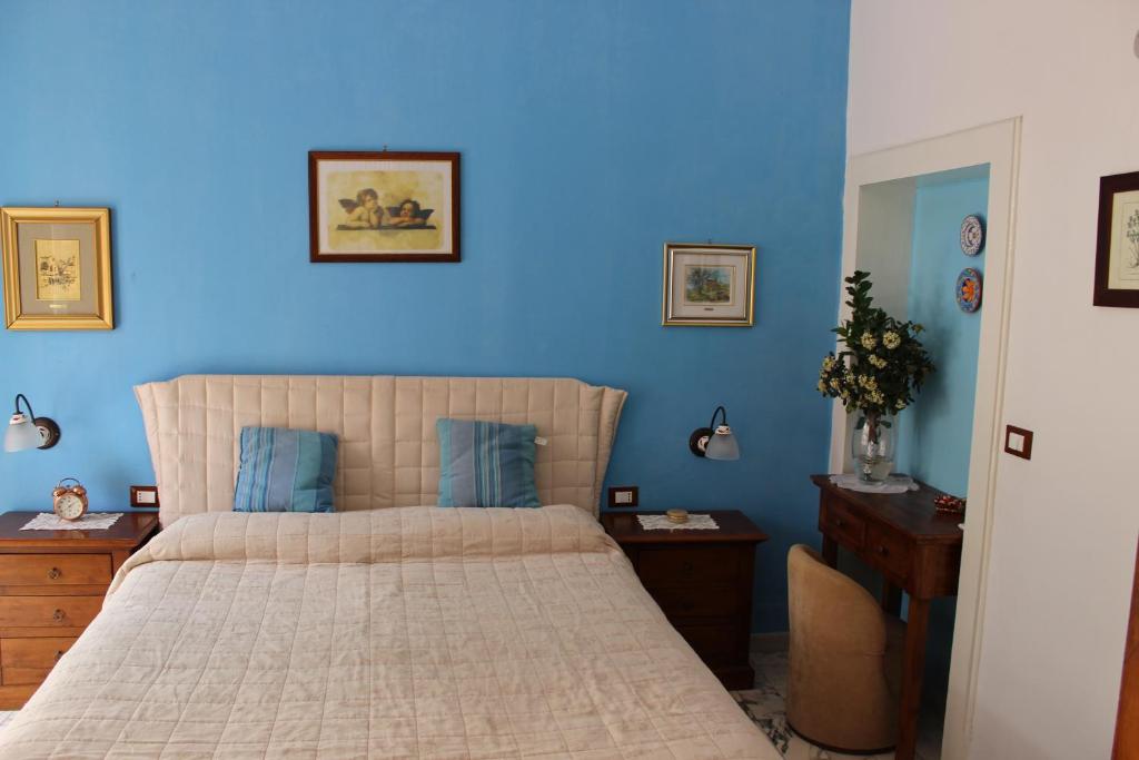 Postel nebo postele na pokoji v ubytování L'Isola Di Ortigia