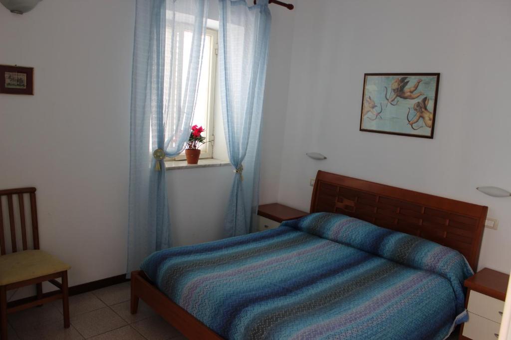 Postel nebo postele na pokoji v ubytování L'Isola Di Ortigia
