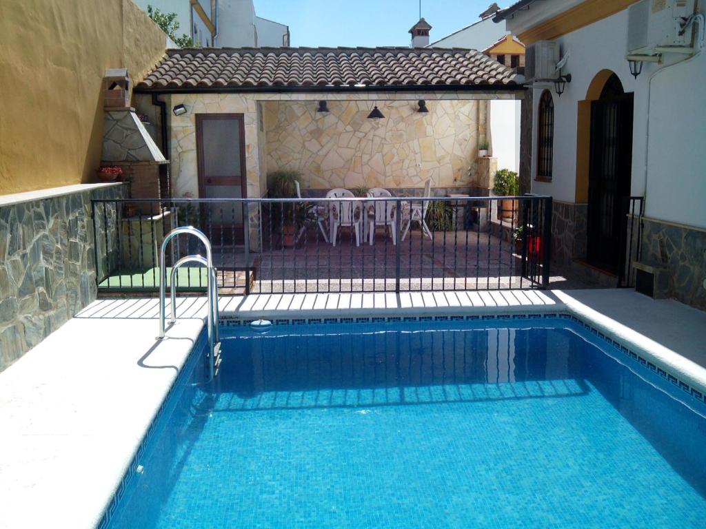 a swimming pool in front of a house at Casa Sierra De Cadiz in El Bosque