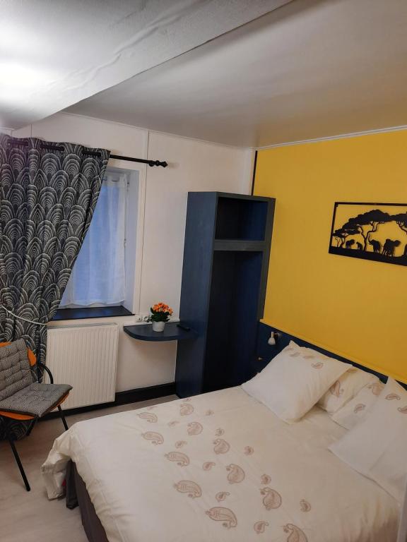 En eller flere senge i et værelse på Le Ch'ti Bourguignon