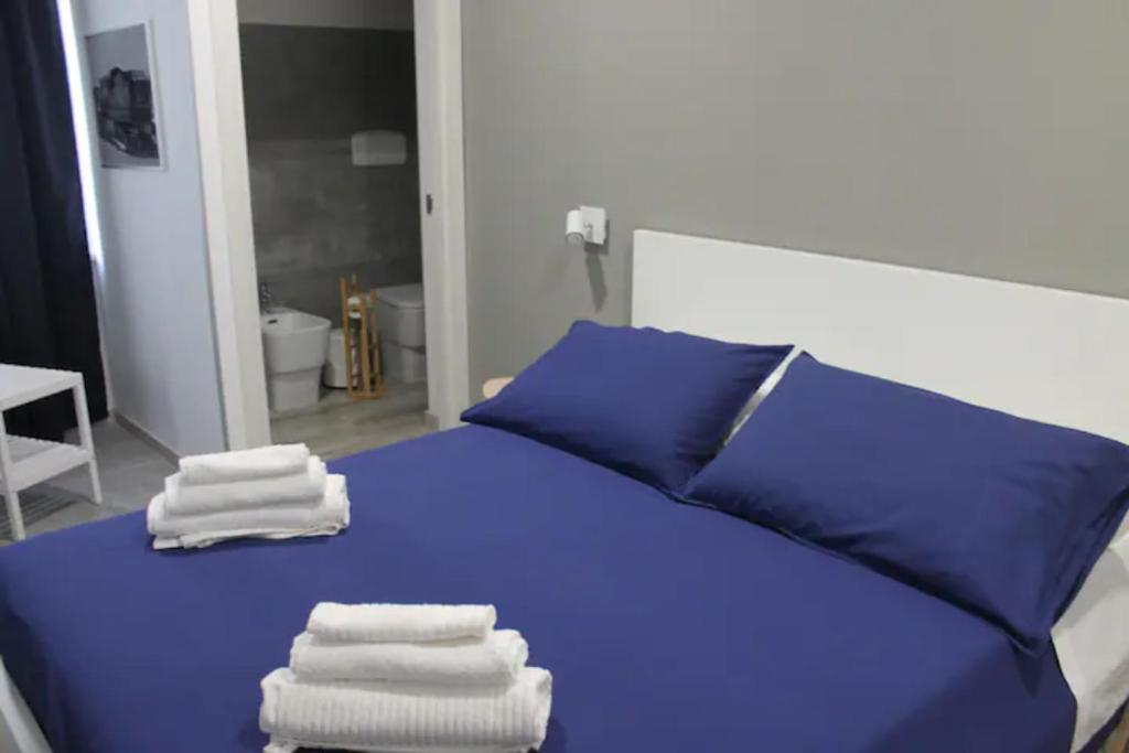 Postel nebo postele na pokoji v ubytování B&B CaselloA Suites