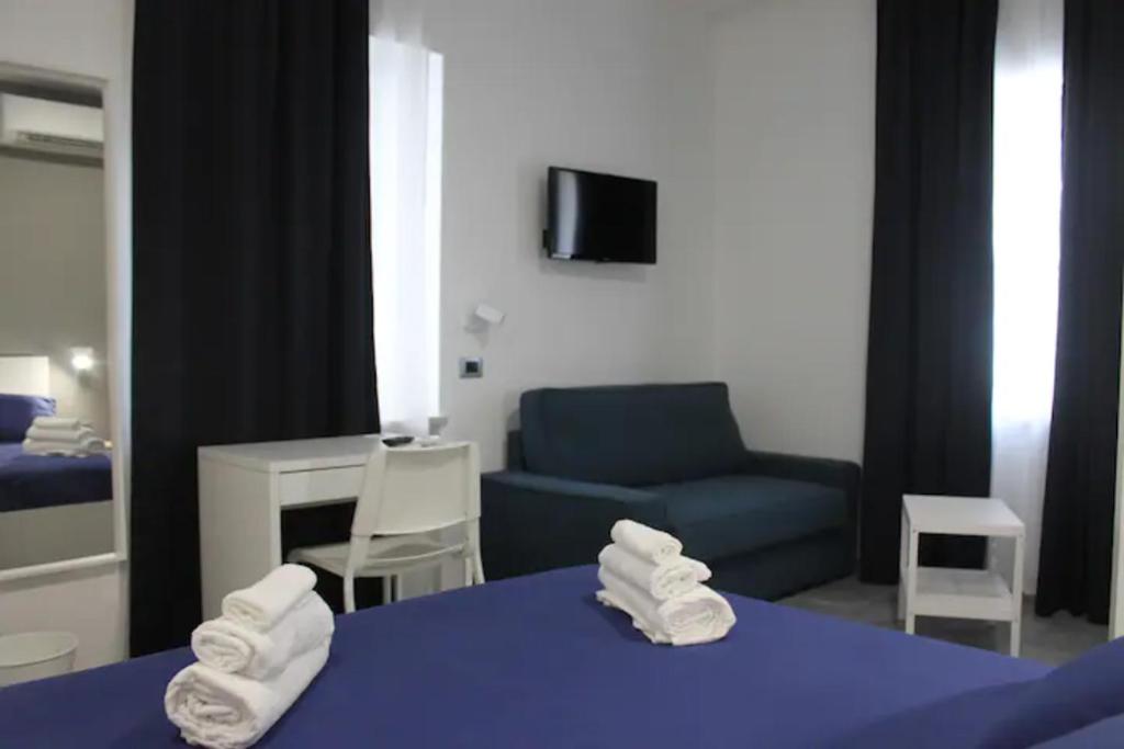 Postel nebo postele na pokoji v ubytování B&B CaselloA Suites