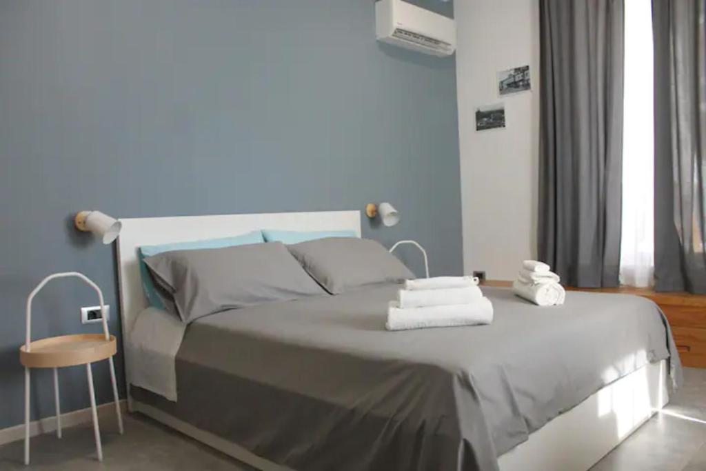 Postel nebo postele na pokoji v ubytování B&B CaselloA Suites