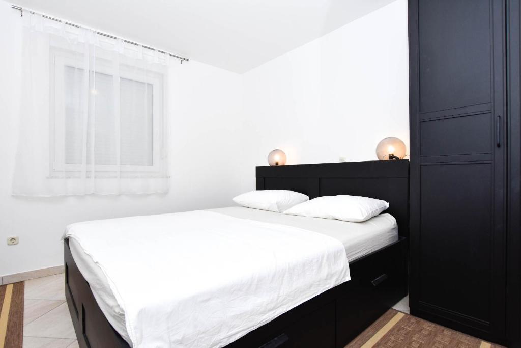 Posteľ alebo postele v izbe v ubytovaní Apartment Jaspis