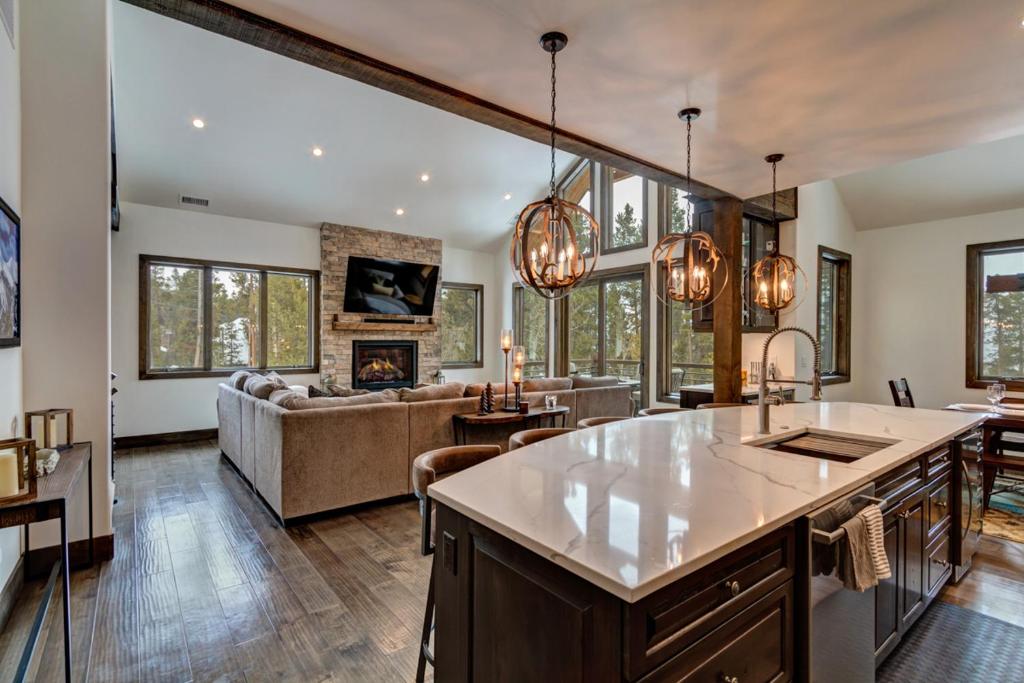 an open kitchen and living room with a couch at Default in Breckenridge