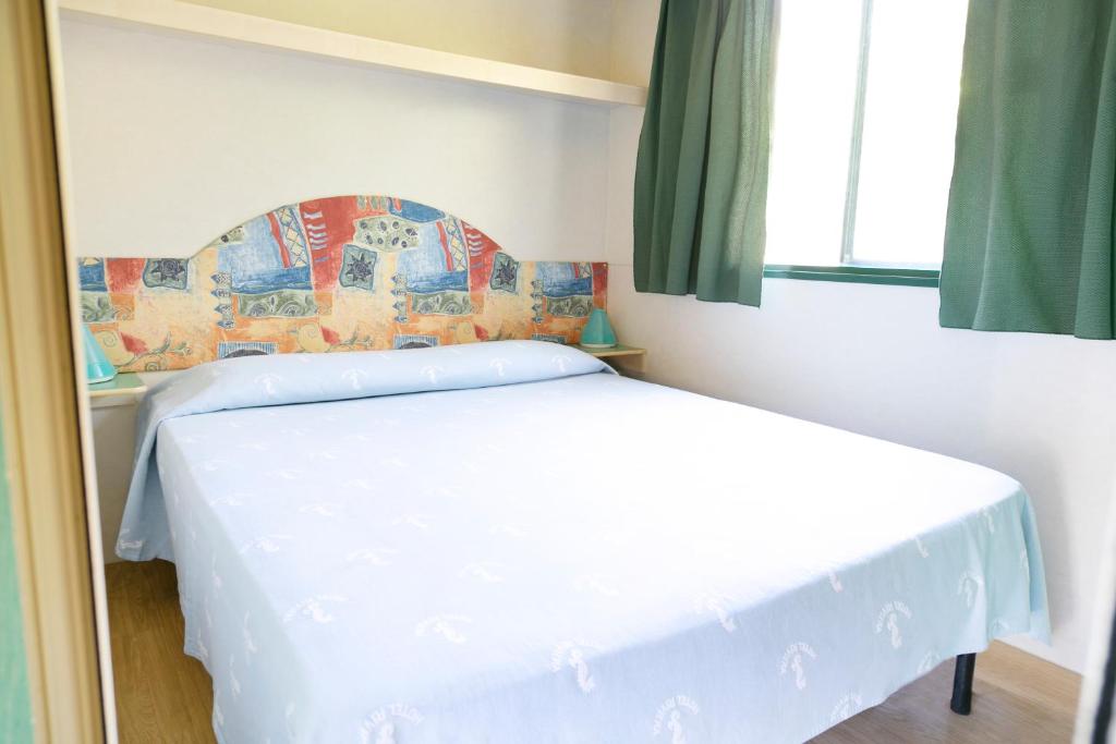 Postel nebo postele na pokoji v ubytování JuliaMare Village
