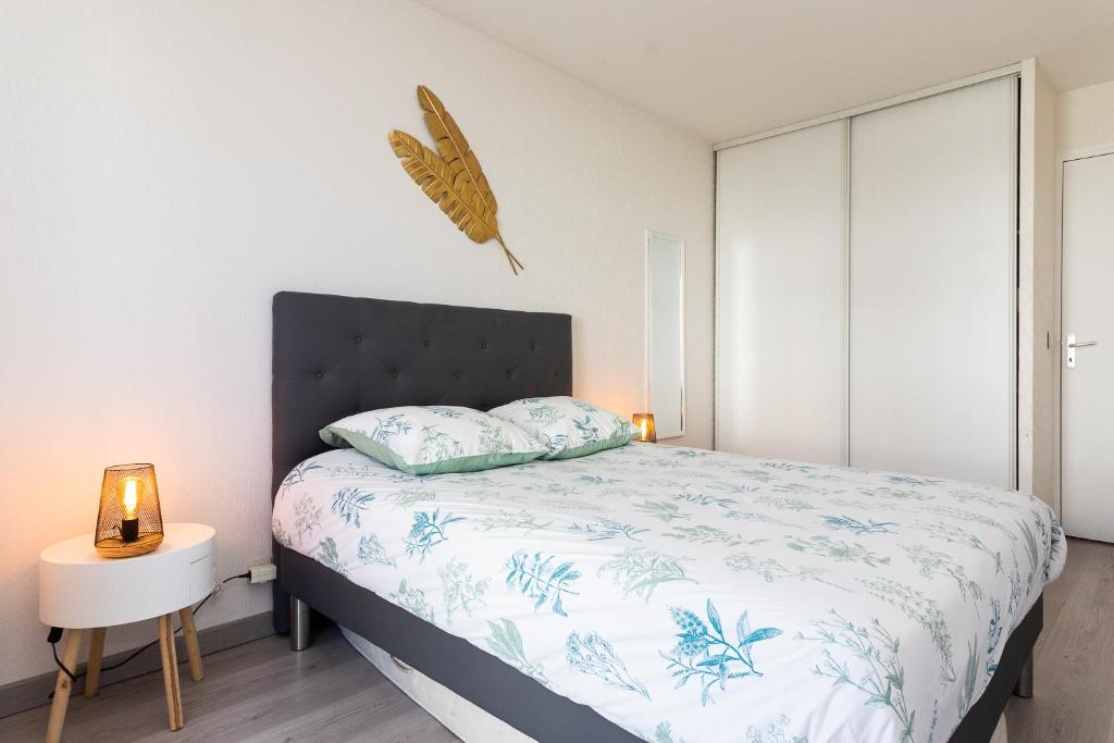 Ein Bett oder Betten in einem Zimmer der Unterkunft Appartement tout confort - Pau Nord