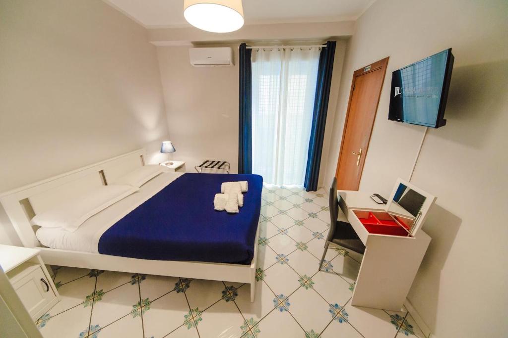 Posteľ alebo postele v izbe v ubytovaní Casa Adele b&b