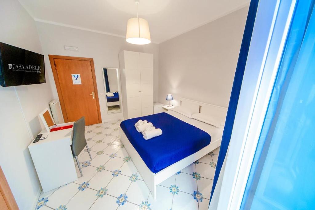 Televízia a/alebo spoločenská miestnosť v ubytovaní Casa Adele b&b