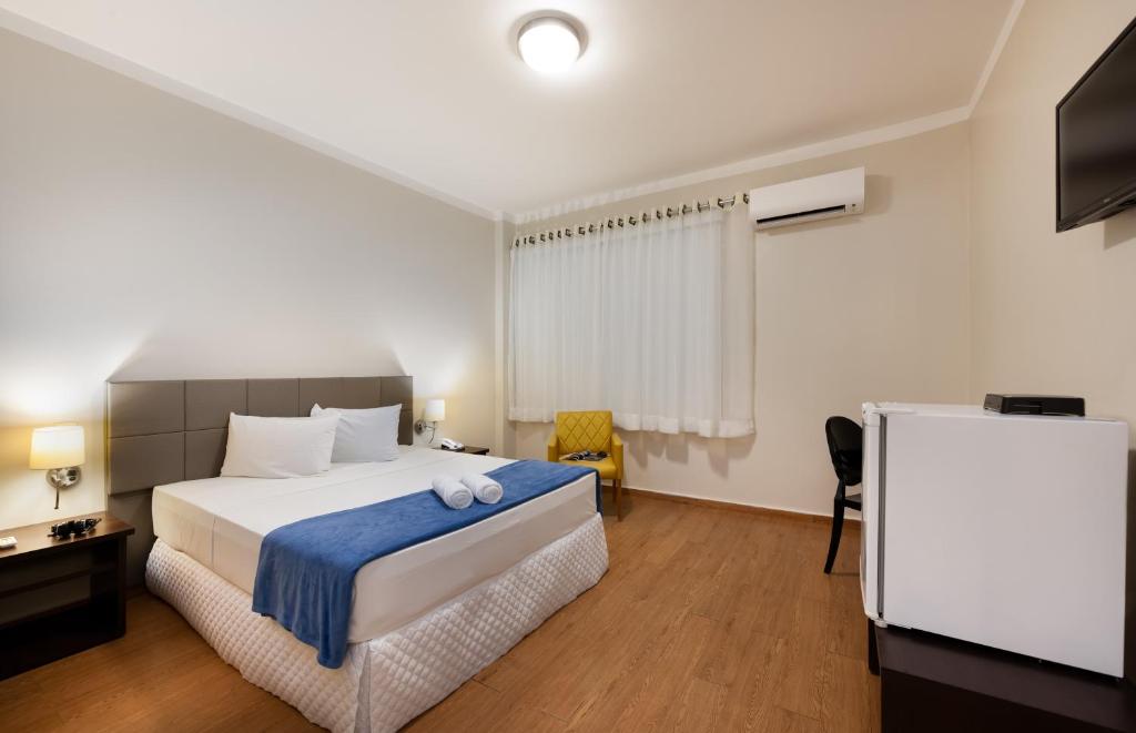 מיטה או מיטות בחדר ב-Mural Living Hotel Manaus