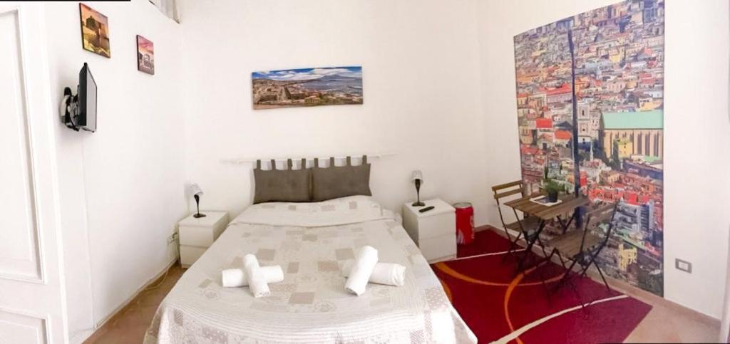 a bedroom with a bed and a painting on the wall at Casa vacanze Caterina in Naples