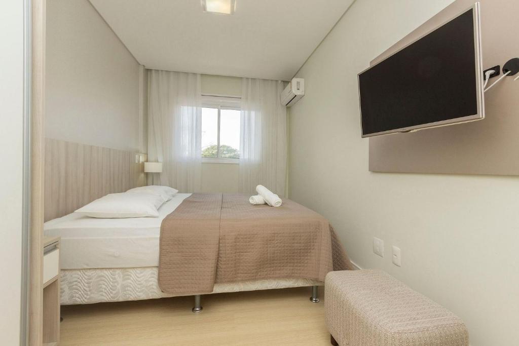  Boulevard Bombinhas 207 - Apto 3 dorms 6 pessoas Condomínio com Piscina Climatizada e Jacuzzi