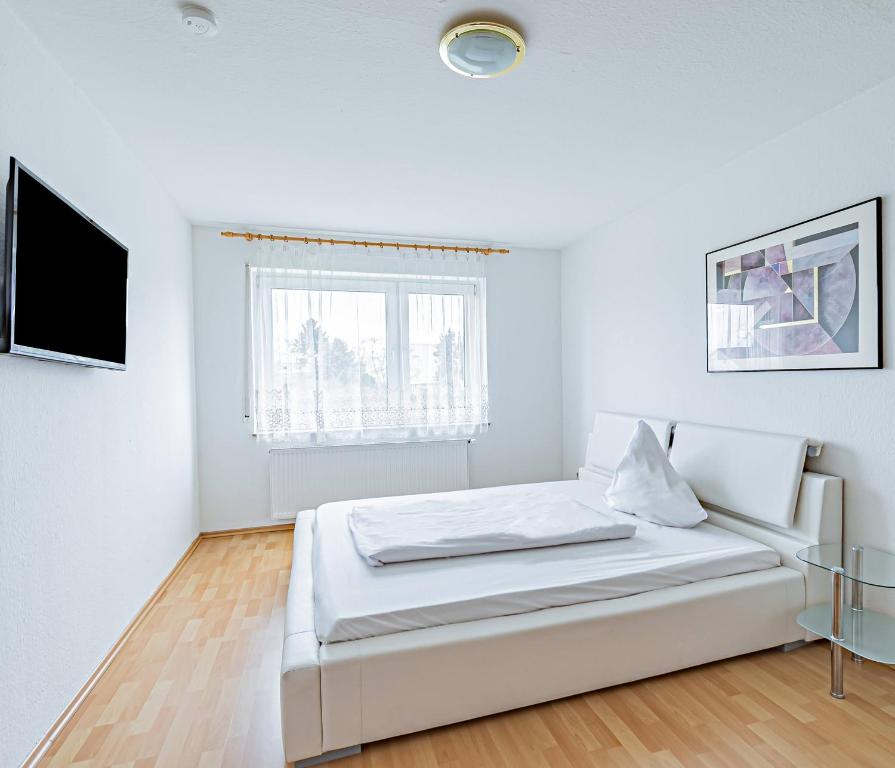 Postel nebo postele na pokoji v ubytování Hotel Tannenblick