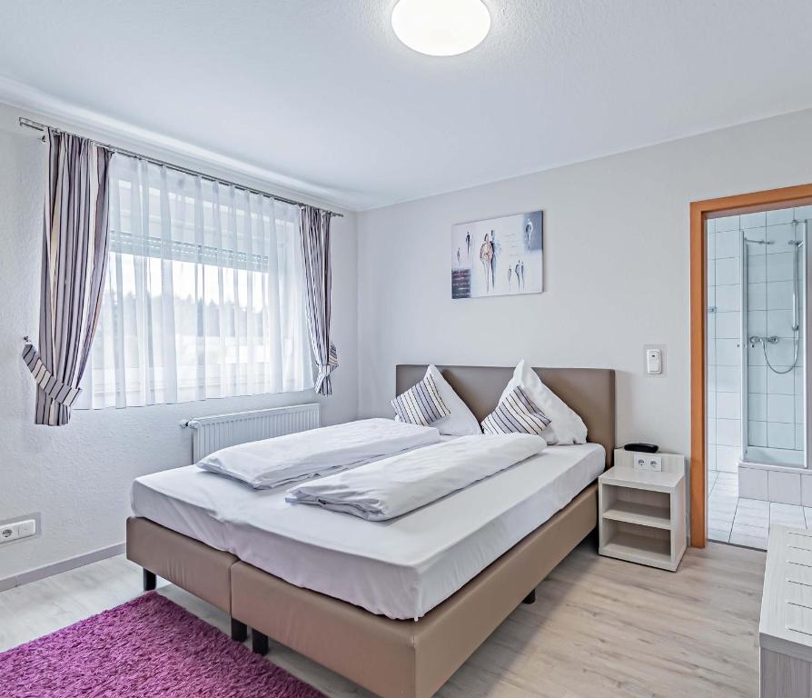 Postel nebo postele na pokoji v ubytování Hotel Tannenblick