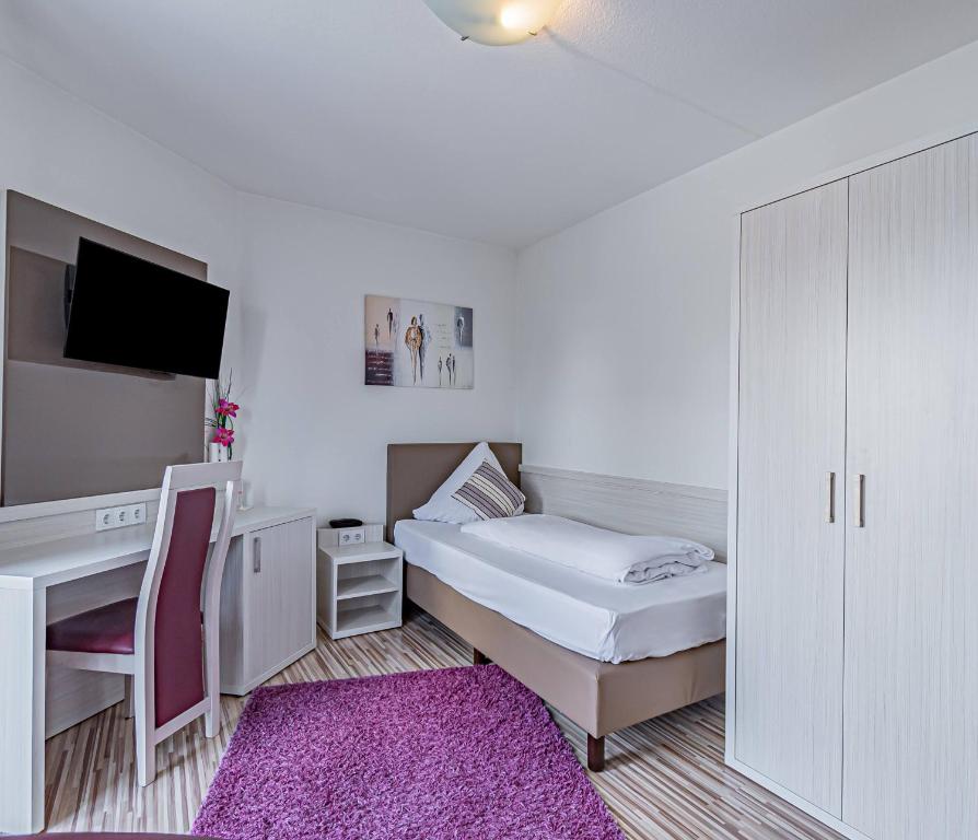 Postel nebo postele na pokoji v ubytování Hotel Tannenblick