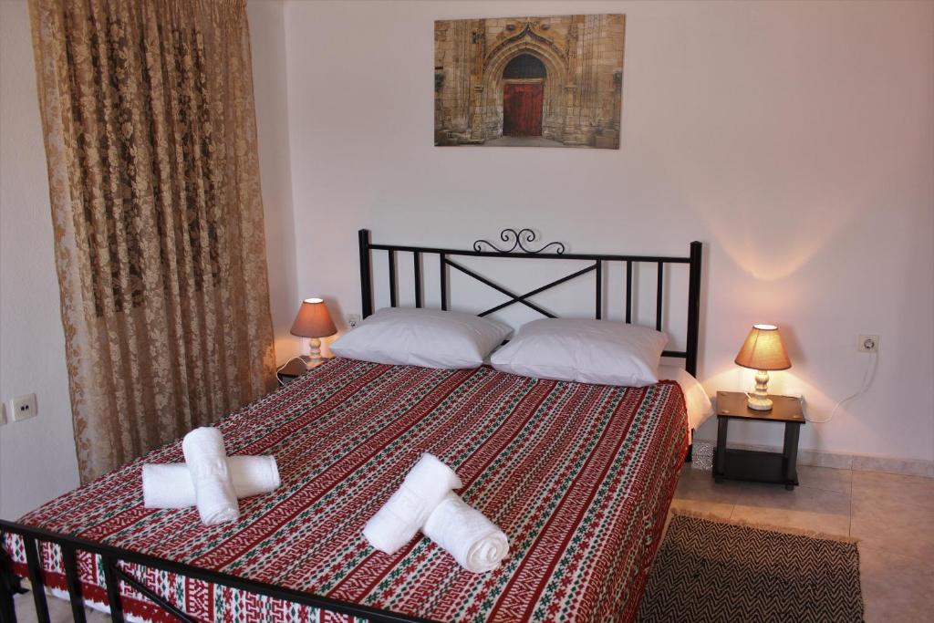 A bed or beds in a room at Traditional Stone house