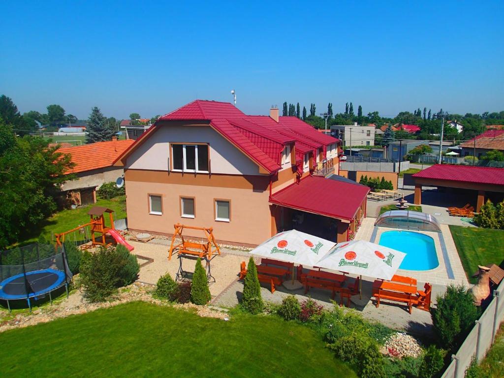 een luchtzicht op een huis met een speeltuin bij Penzión ONE in Dolný Ohaj