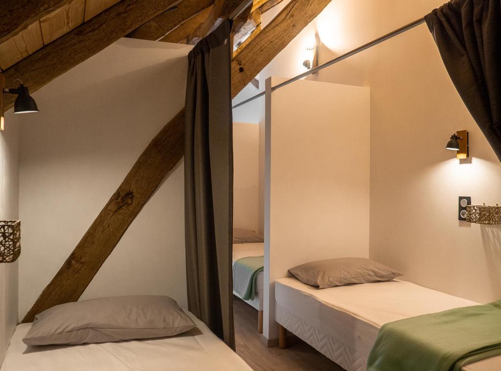 Postel nebo postele na pokoji v ubytování AUBERGE BORDA