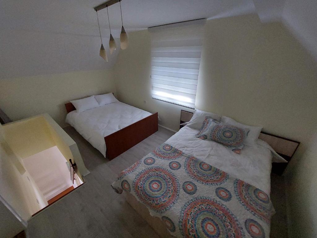 Postel nebo postele na pokoji v ubytování Sunny Funny House