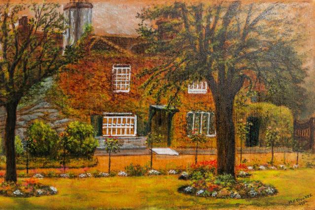 une peinture d'une maison avec des fleurs devant elle dans l'établissement Swan Guest House LONDON - HEATHROW, à Hillingdon