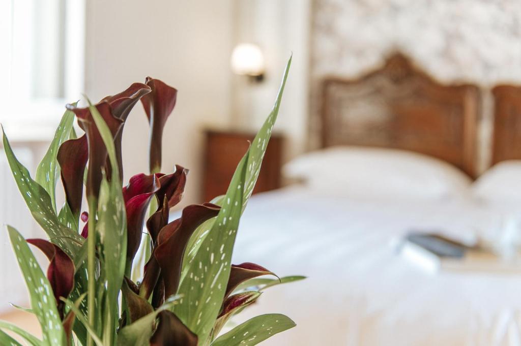 Postel nebo postele na pokoji v ubytování Hotel Aganoor