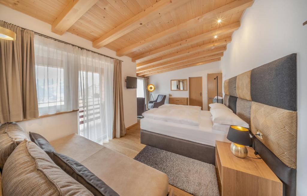 Posteľ alebo postele v izbe v ubytovaní Hotel Rodella