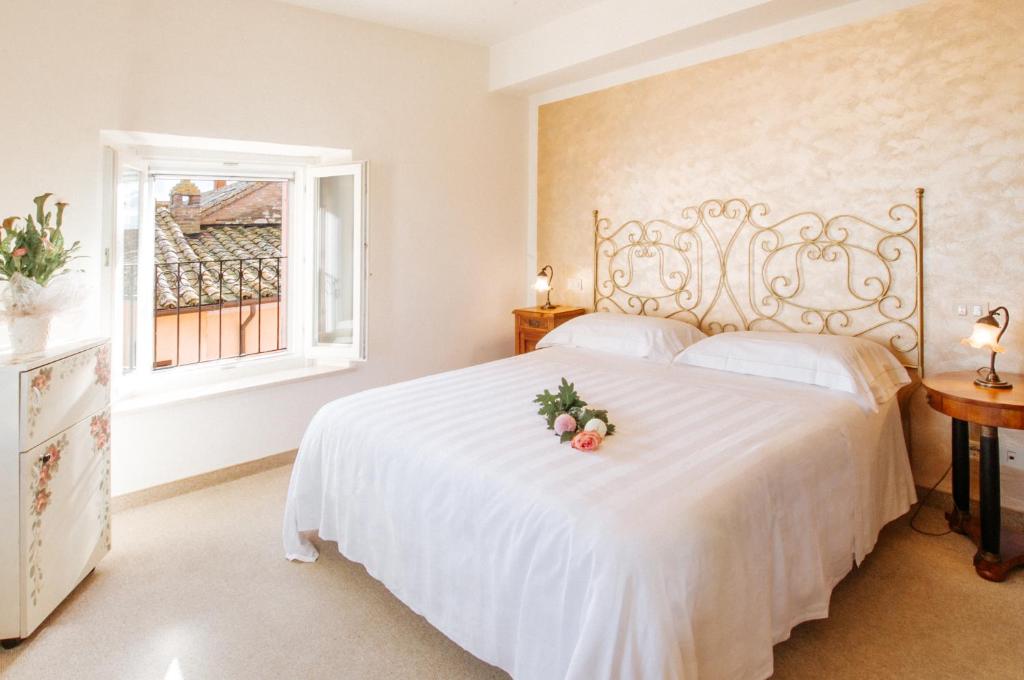 Postel nebo postele na pokoji v ubytování Hotel Aganoor