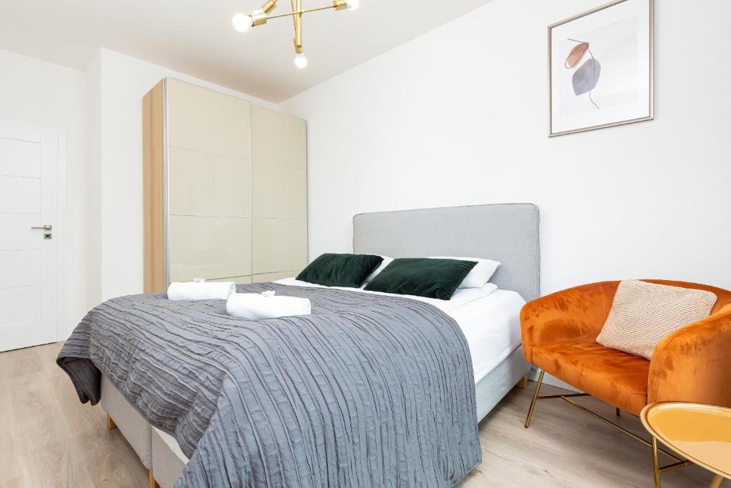 Posteľ alebo postele v izbe v ubytovaní Metro Płocka Exquisite Apartments by Noclegi Renters