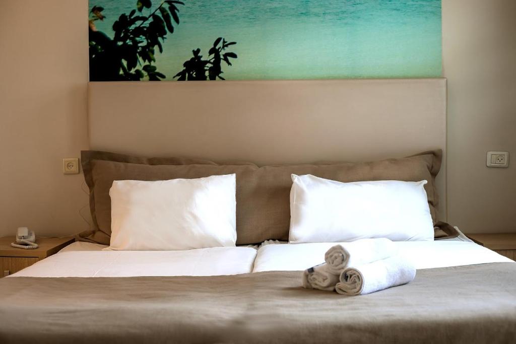 Postel nebo postele na pokoji v ubytování Acco Beach Hotel