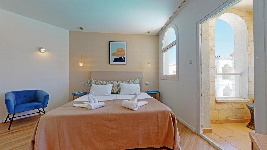 Postel nebo postele na pokoji v ubytování Acco Beach Hotel