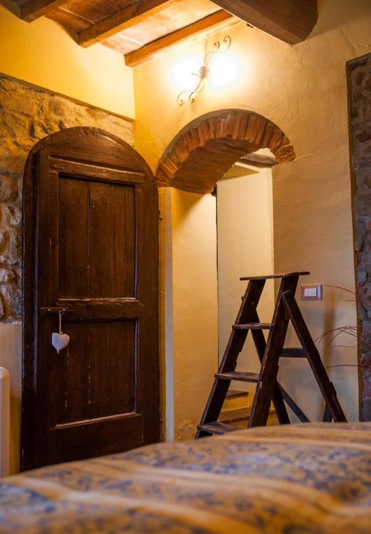 Postel nebo postele na pokoji v ubytování Bioagriturismo Poderaccio