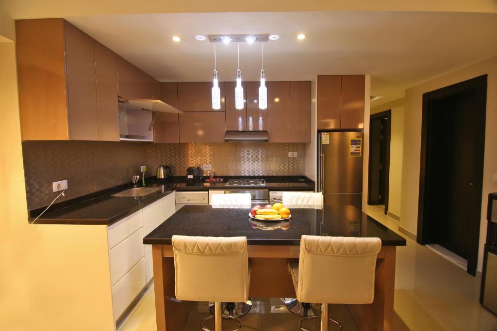 Kuchyň nebo kuchyňský kout v ubytování AlAshrafia Smart Residence