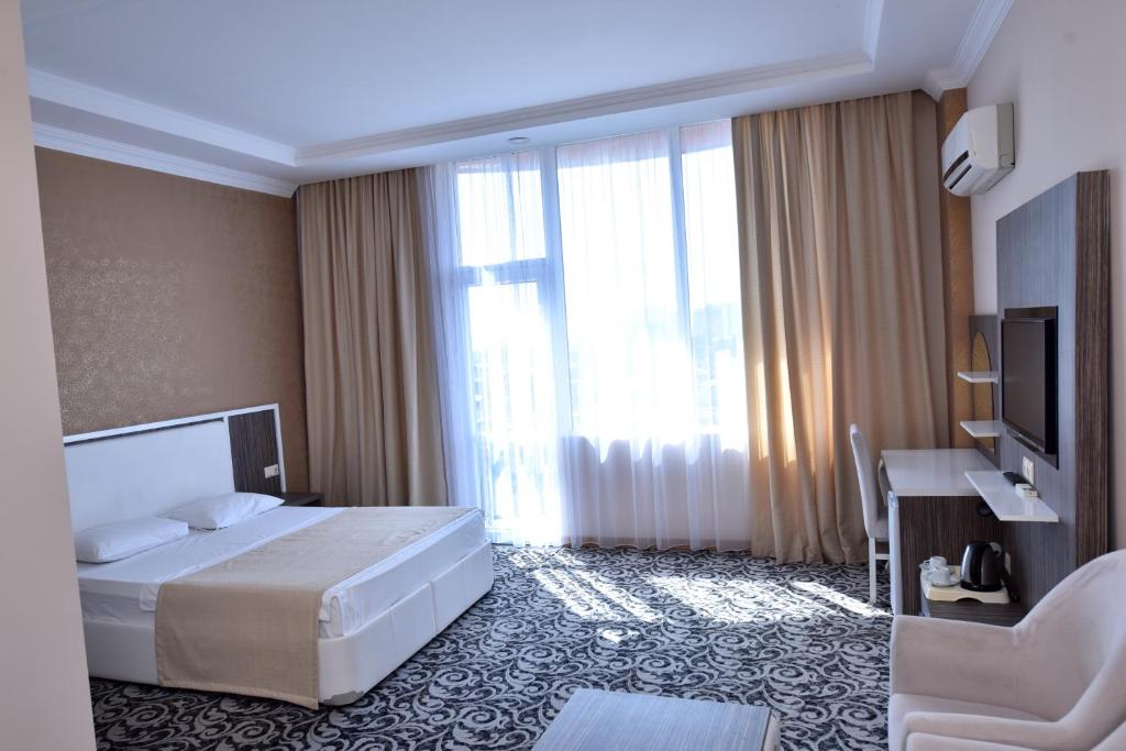 Postel nebo postele na pokoji v ubytování Grand Georgian Palace