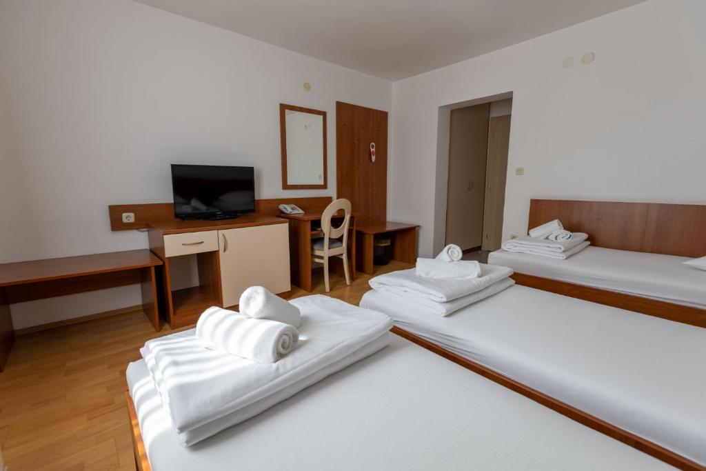 Postel nebo postele na pokoji v ubytování Hotel Porto