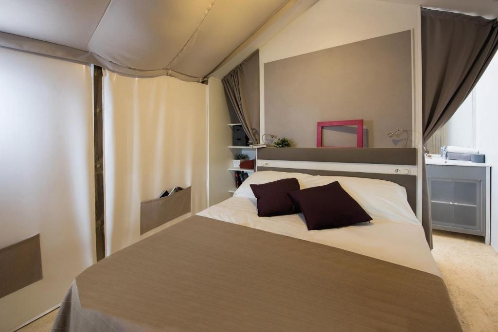 Postel nebo postele na pokoji v ubytování Camping Village Scaglieri