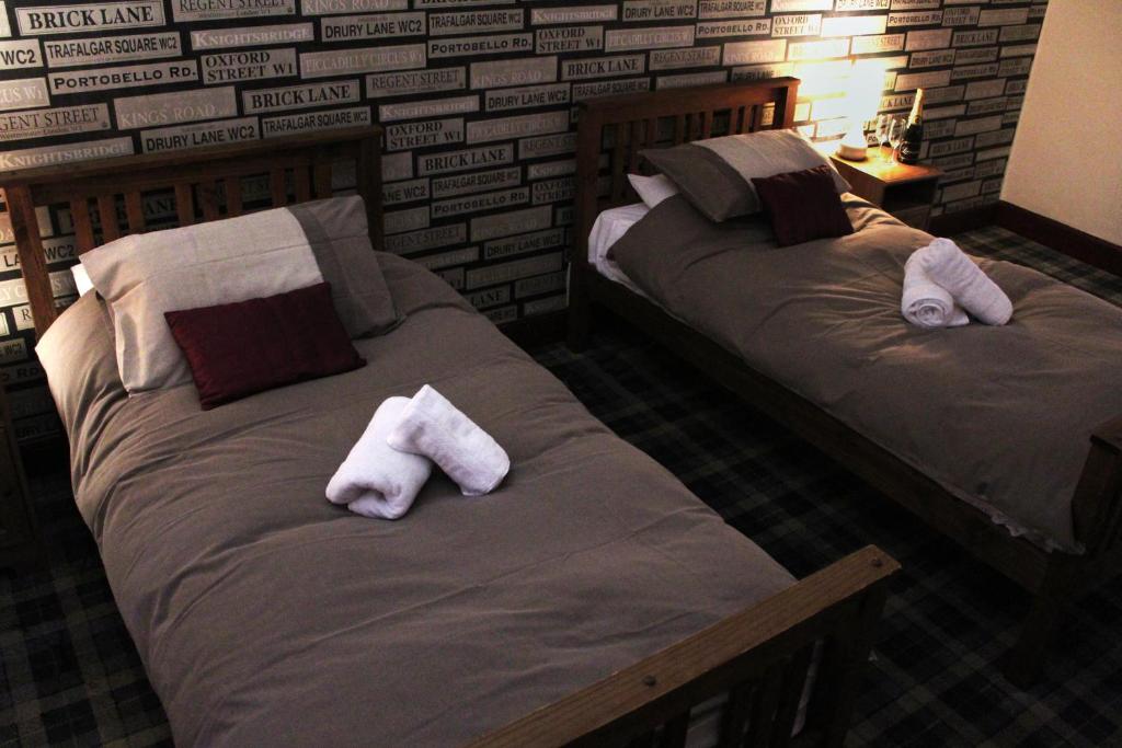 Postel nebo postele na pokoji v ubytování The Castle Inn