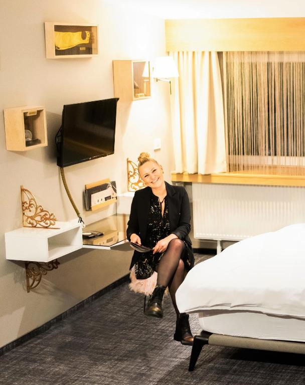 TV a/nebo společenská místnost v ubytování Hotel Kunst
