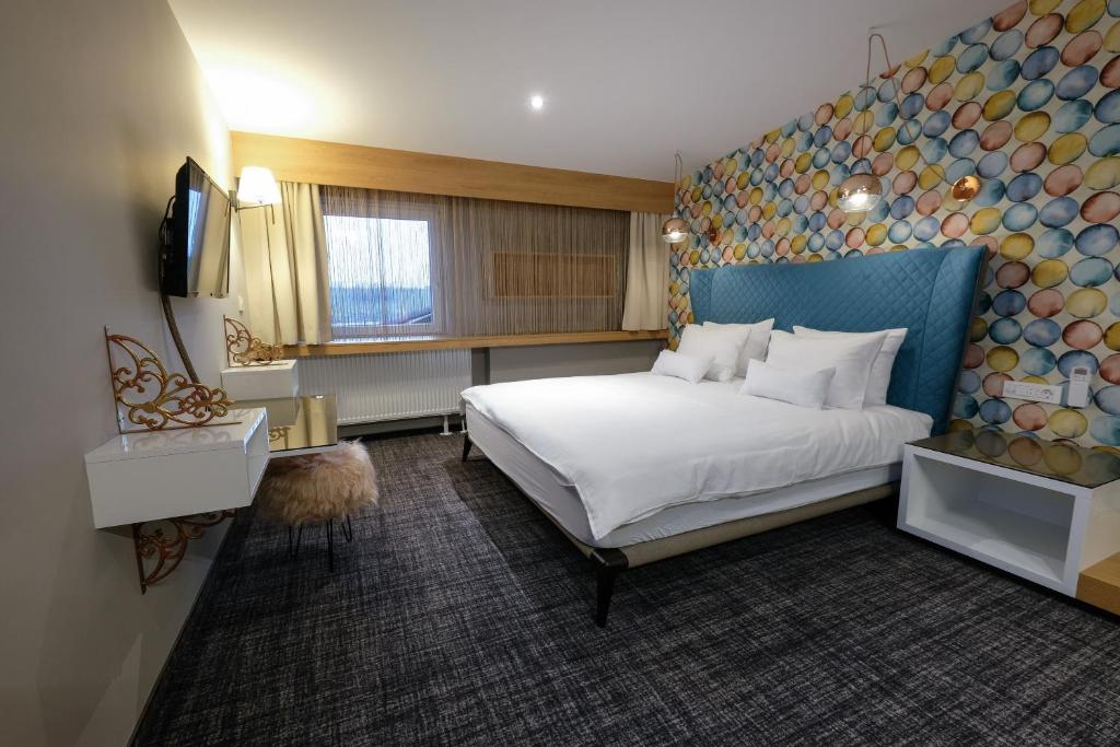 Postel nebo postele na pokoji v ubytování Hotel Kunst
