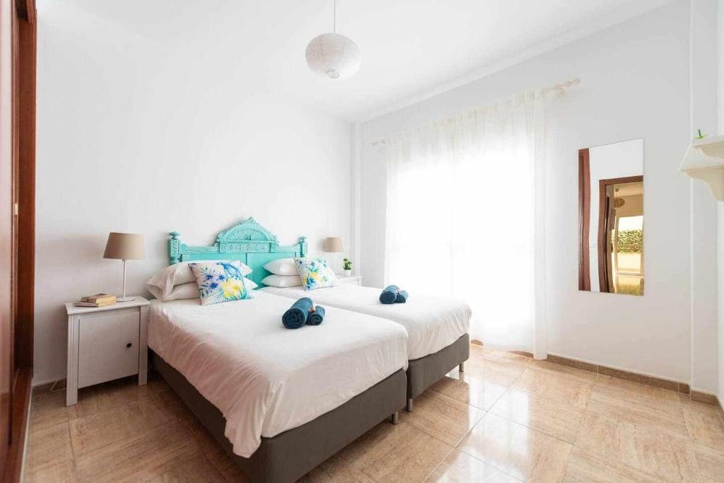Postel nebo postele na pokoji v ubytování Casa Cotillo - Booking Best Choice - Fibre Internet